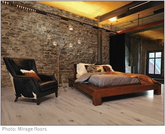 industrial bedroom with stone walls and blonde wood floor