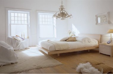 All white minimalist bedroom with blonde wood